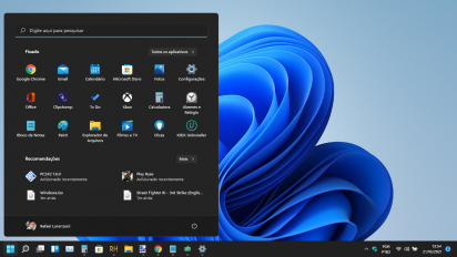 Captura de tela demonstrativa padrão do Windows 11. A barra de tarefas está com a configuração escura e está alinhada à esquerda. O fundo é o padrão do sistema e o menu Iniciar está alinhado à esquerda e está aberto. O perfil está configurado do usuário Rafael Lorenzoni, administrador do site www.baixesoft.com.